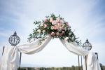 Blush pink wedding arch flowers | bush flowers on a wedding arch