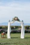 white draped arch with pink flowers | Princess wedding Arch